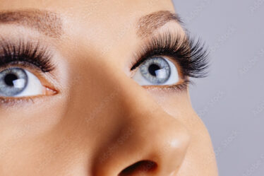 Woman eyes with long eyelashes and smokey eyes make-up. Eyelash extensions, makeup, cosmetics, beauty